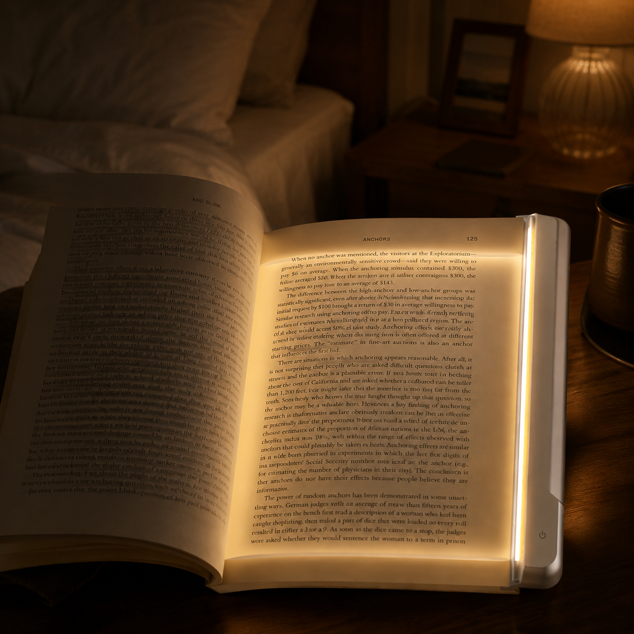 Dark bedroom with LumiPage illuminating an open book